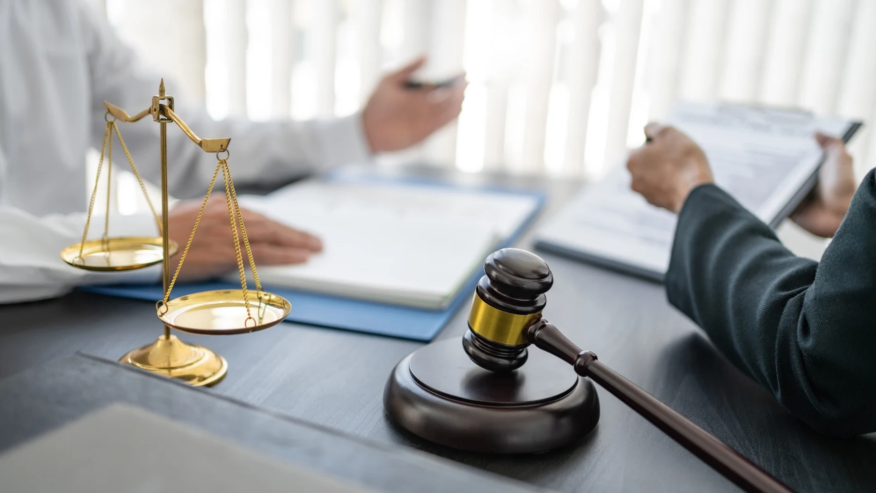 Legal consultation with documents and gold scales